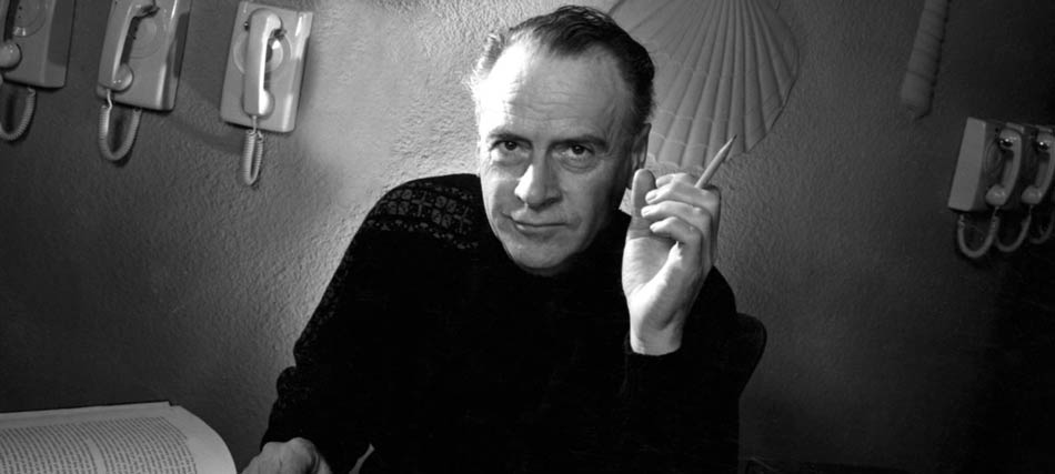 Marshall McLuhan with book